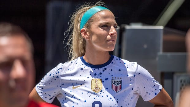 Julie Ertz stands on the sidelines before a game between the United States and Wales.